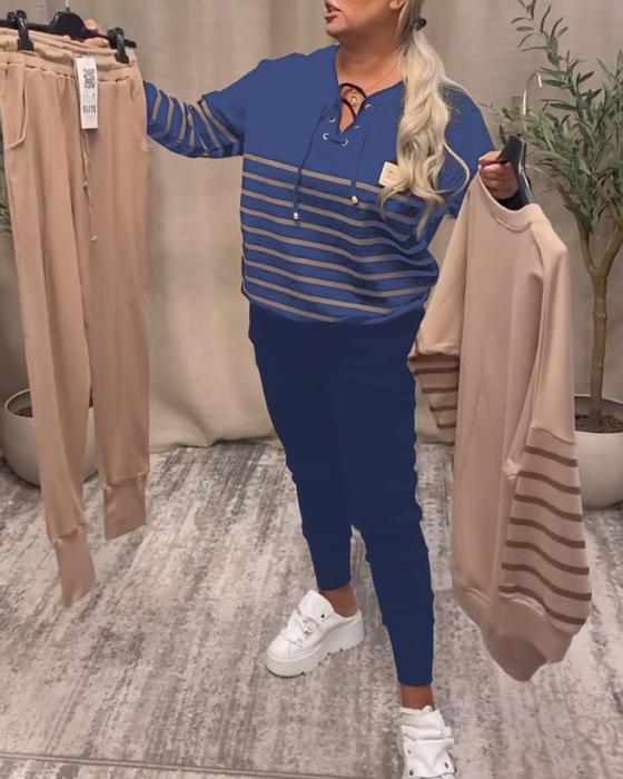 Tvådelat Set Med Avslappnad Randig Sportbyxa Vid Ankeln