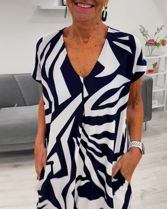 V-ringad kortärmad klänning med tryck