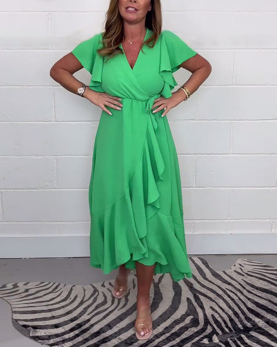 Volang elegant klänning i enfärgad slits