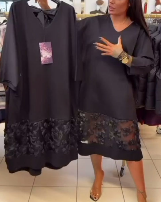 Stilfull Klänning Med Rosett På Ryggen Och V-Ringning