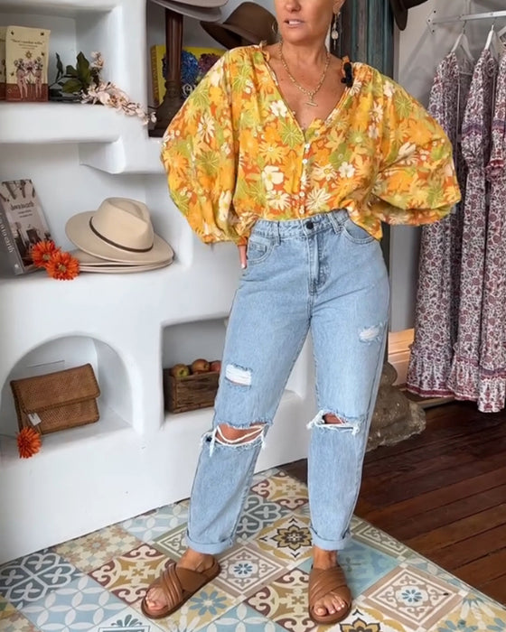 V-ringad blus med blommönster