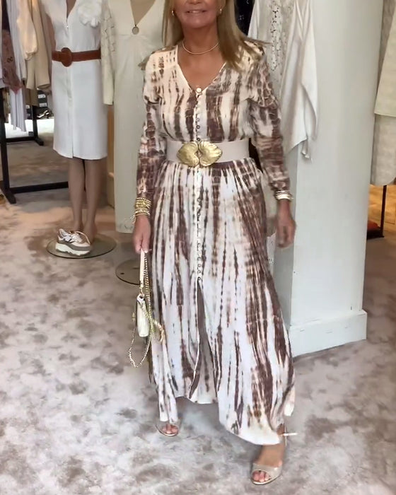 Tryckt långärmad klänning med V-ringad slits i midjan