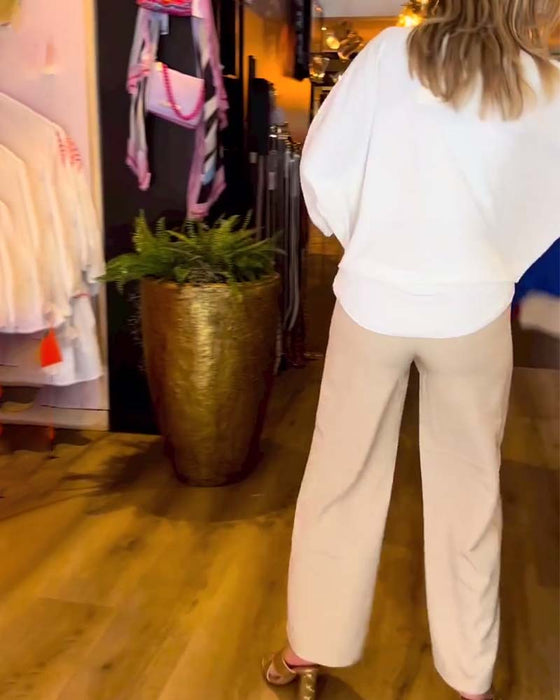 Knytblus i enfärgad V-ringning