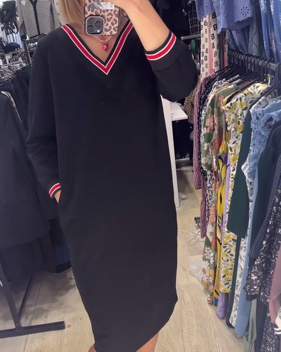 V-ringad klänning med fickor