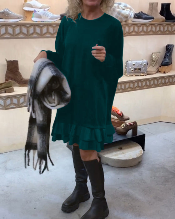 Klänning med elegant siluett och långa ärmar