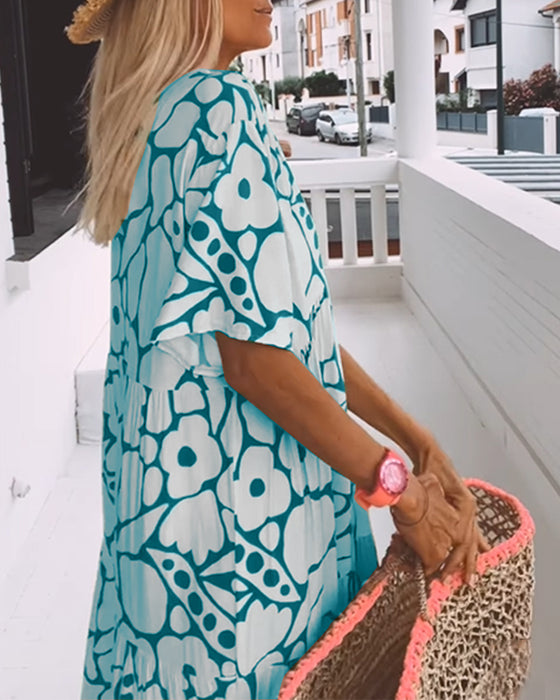 Tryckt lös klänning med v-ringning