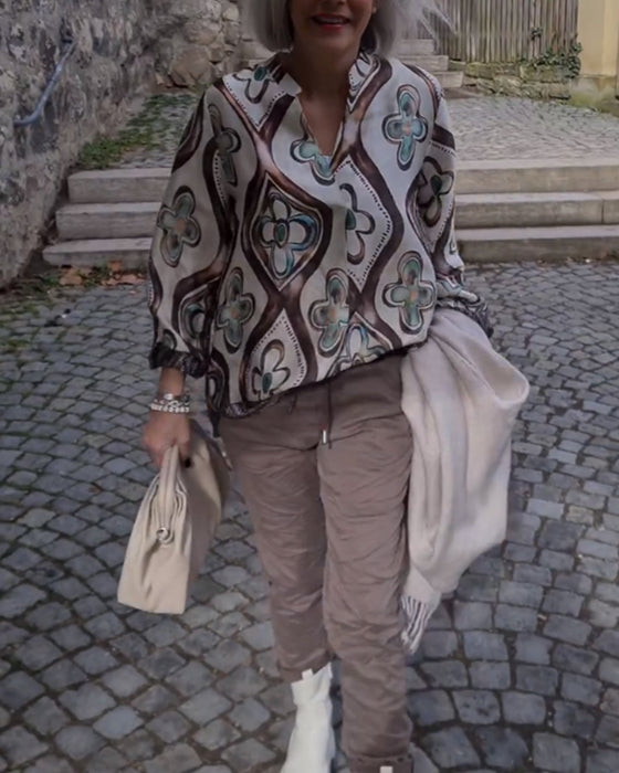 Blus med retrostil och långa ärmar