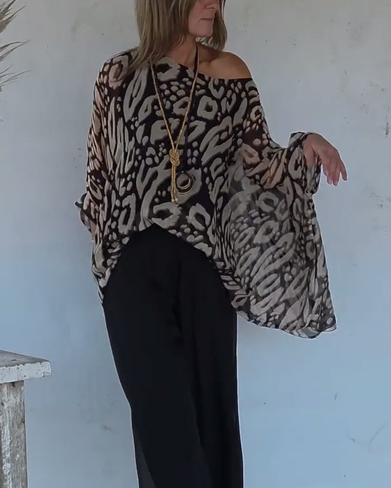 Oregelbunden Blus Med Fladdermusmönster Och Lång Ärm