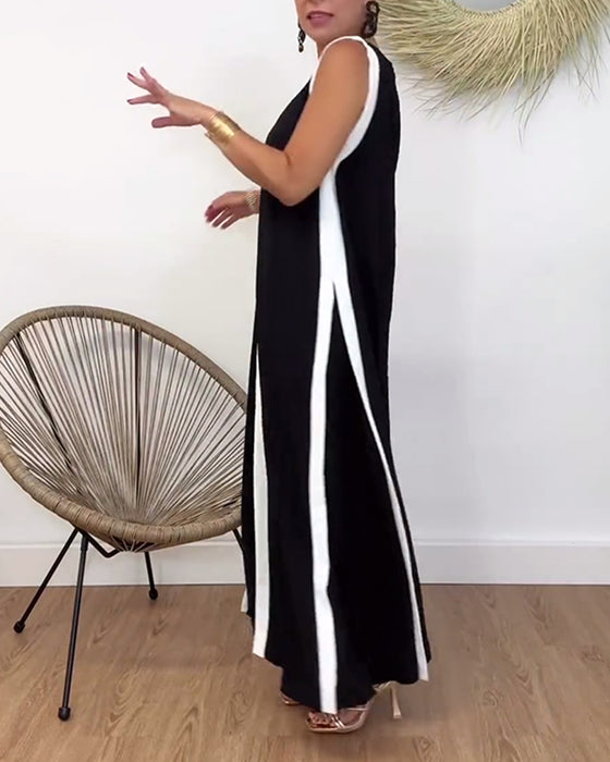 Trendig ärmlös klänning med V-ringad kontrasttryck