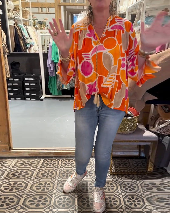 Blus med färgstarkt och långärmad design