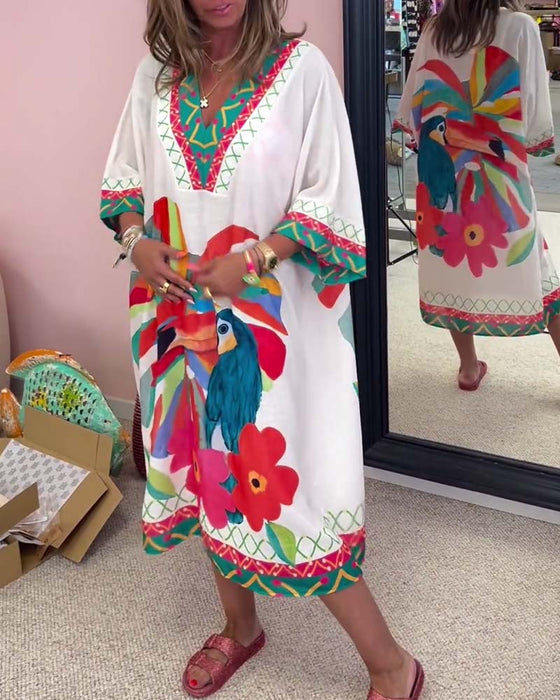 V-ringad klänning med graffititryck