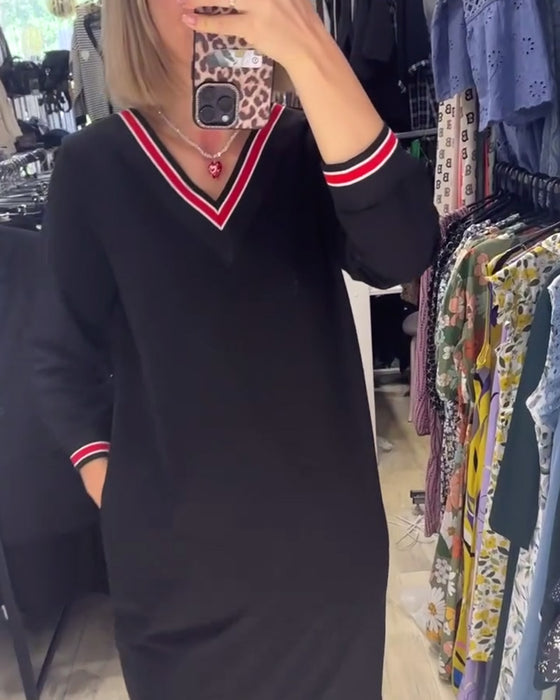 V-ringad klänning med fickor