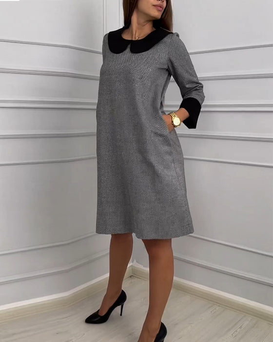 Avslappnad klänning med fickor och Peter Pan-krage