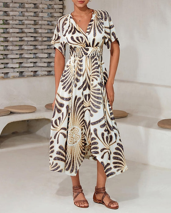 Tryckt V-ringad oregelbunden elegant klänning