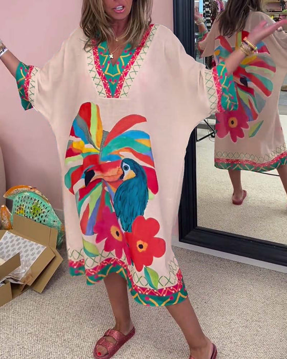 V-ringad klänning med graffititryck