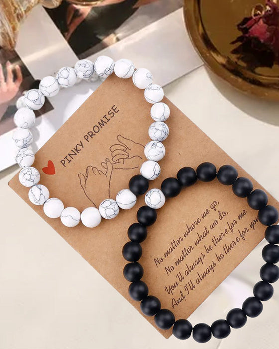 Armbandsset med vävda pärlor i svart och vitt