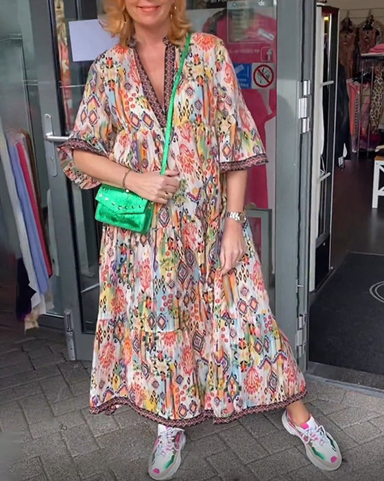 V-ringad elegant lång klänning med tryck