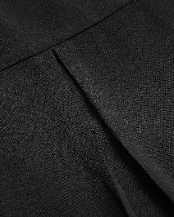 Avslappnad topp med paljettknappar med panel