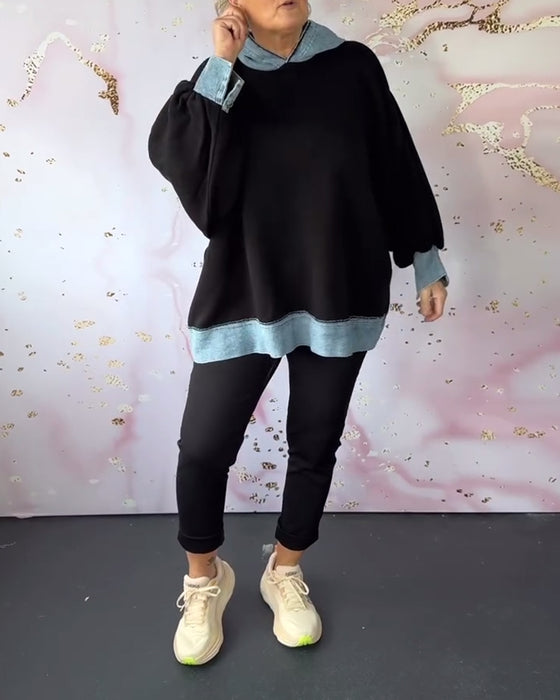 Avslappnad luvtröja på lyktaärm i kontrastfärg