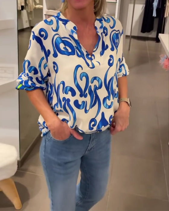 Elegant långärmad topp med tryckt V-ringning