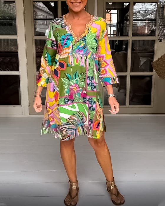 Fritidsklänning med blom- och grästryck