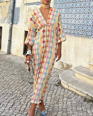 V-ringad elegant klänning med  lykta ärmar och geometriskt tryck