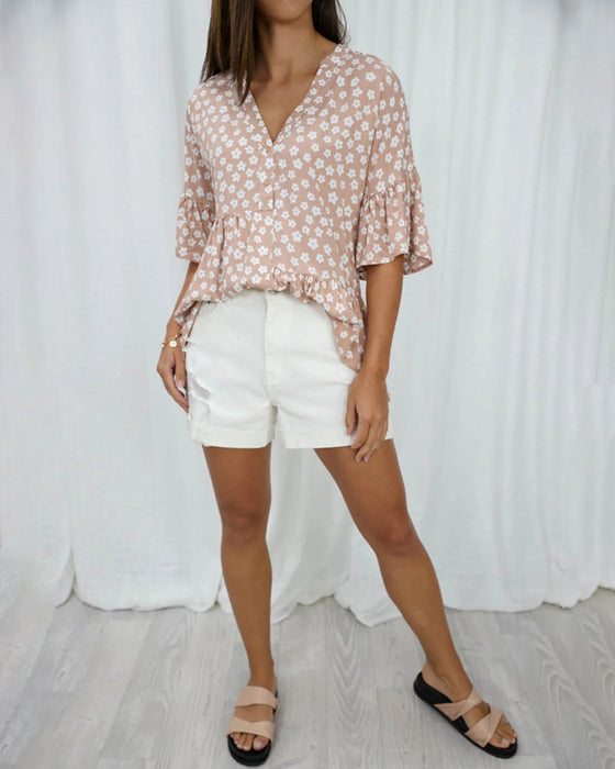 Blommig blus med V-ringad klockärm