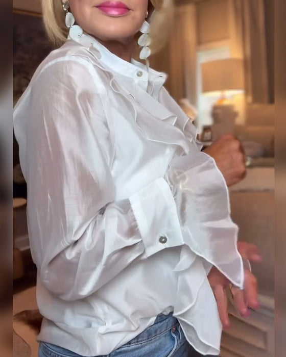 Elegant blus med enfärgad volang