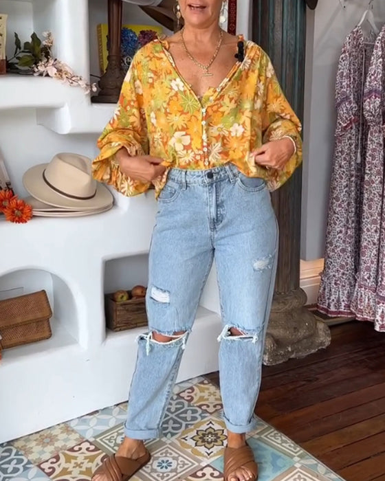 V-ringad blus med blommönster