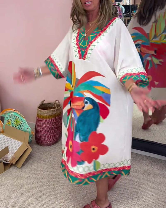 V-ringad klänning med graffititryck