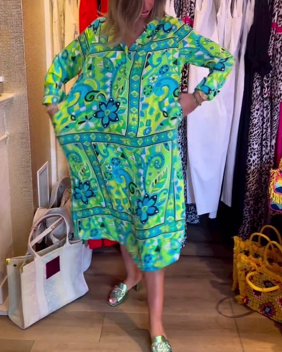 Klänningar med lös passform och tryck och fickor