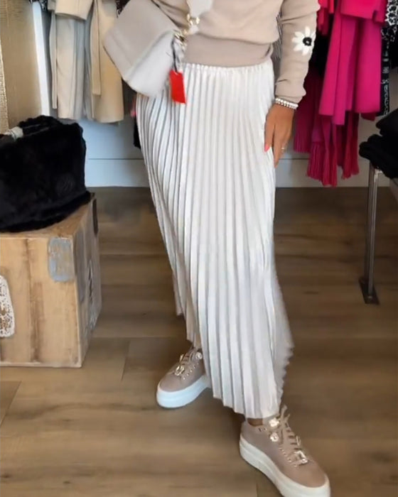 Plisserad enfärgad klänning