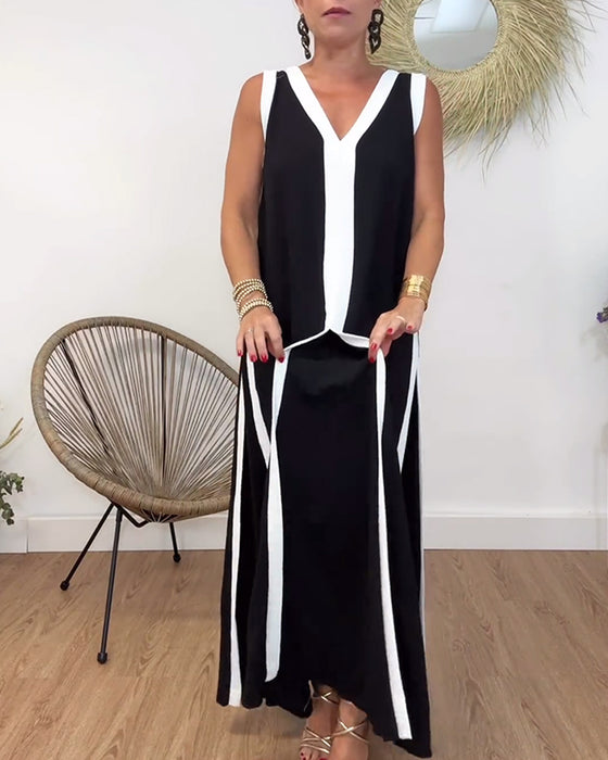 Trendig ärmlös klänning med V-ringad kontrasttryck