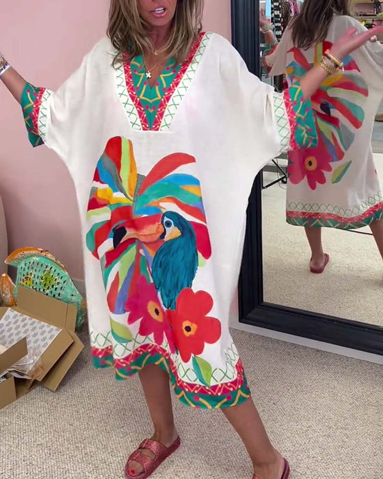 V-ringad klänning med graffititryck