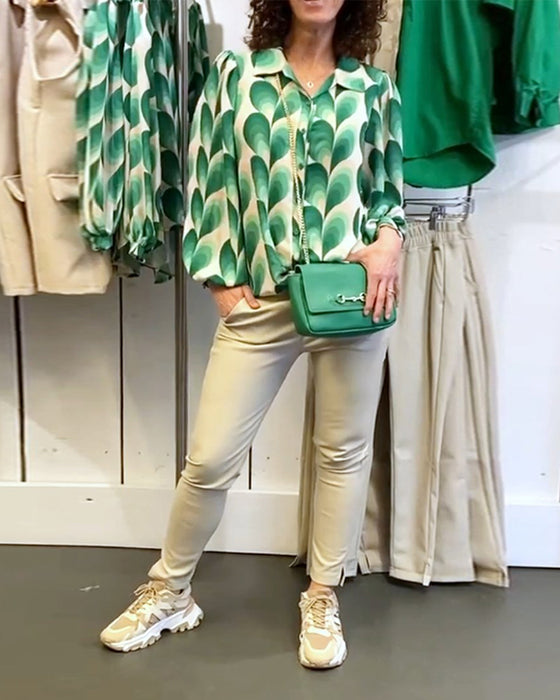 Blus med slag och tryck