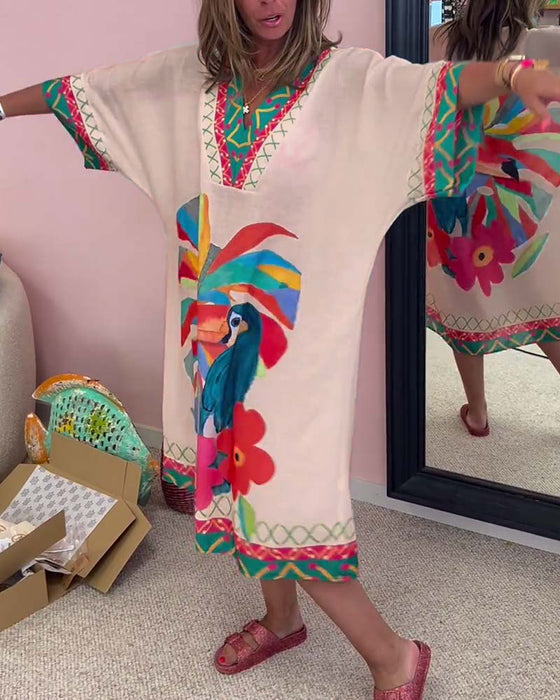 V-ringad klänning med graffititryck