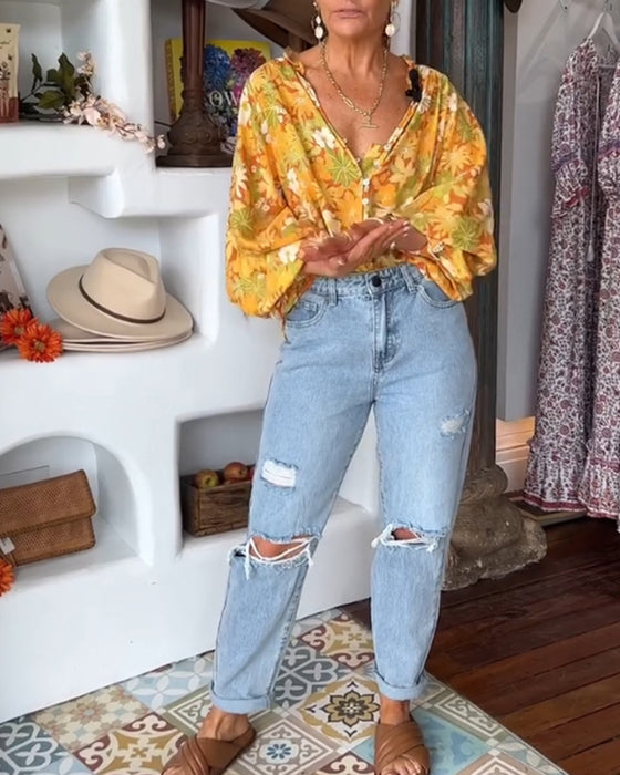 V-ringad blus med blommönster