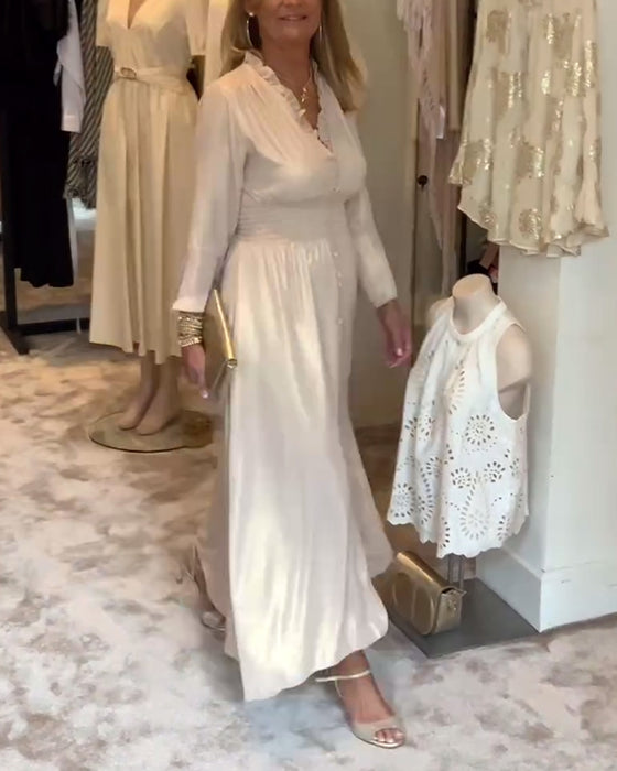 Lång klänning i spetskrage med knäppning i midjan