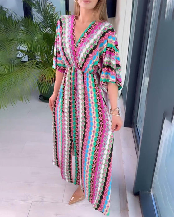 Färgglad klänning med lapptäcketryck med V-ringning och trekvartsärm