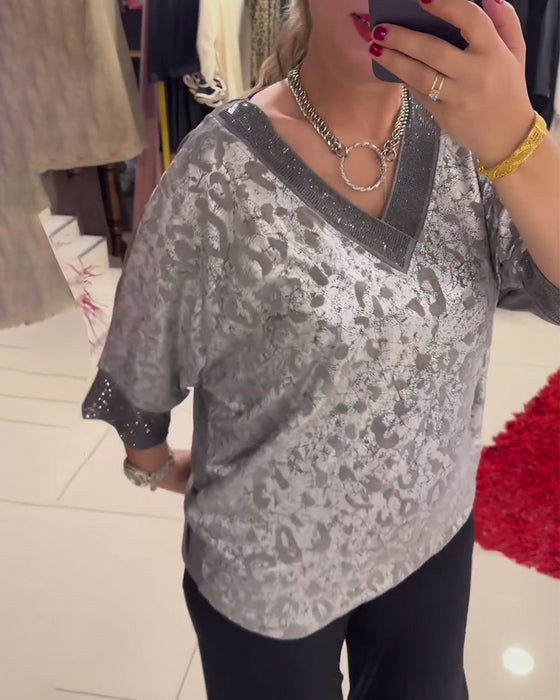 V-ringad avslappnad blus med tryck