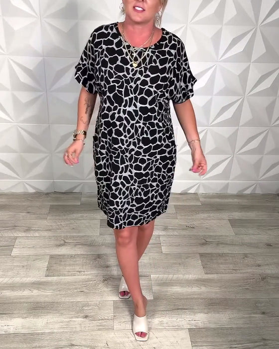 Klänning avslappnad med tryck och rund halsringning