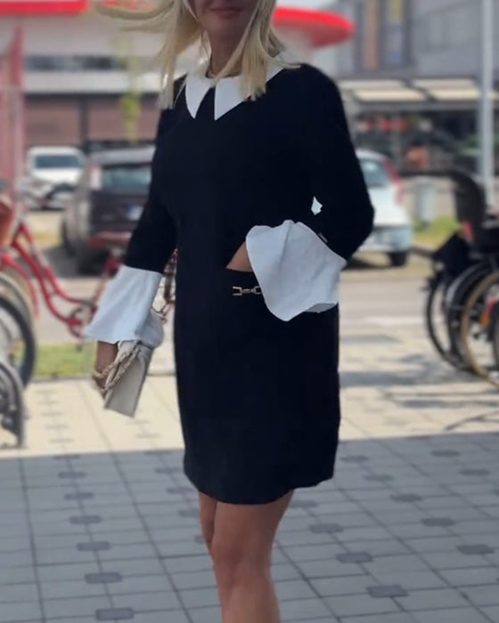 Elegant klänning med klockärm i kontrast