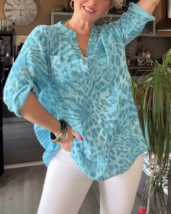 Tryckt blus med V-ringad ficka med trekvartsärm och knapp