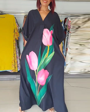 Blommig lång klänning med V-ringad slits