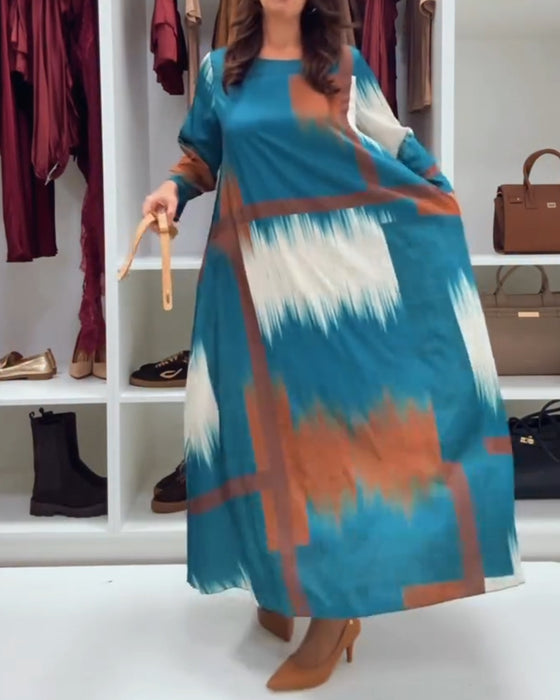 Modig Tryckt Klänning Med Runt Halsutsnitt Och Långa Ärmar