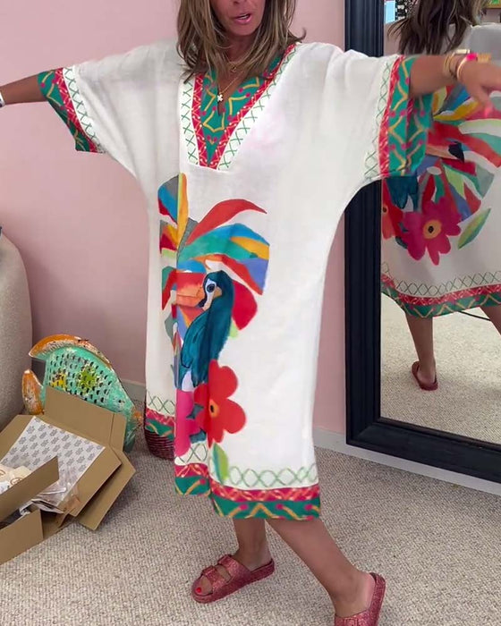 V-ringad klänning med graffititryck