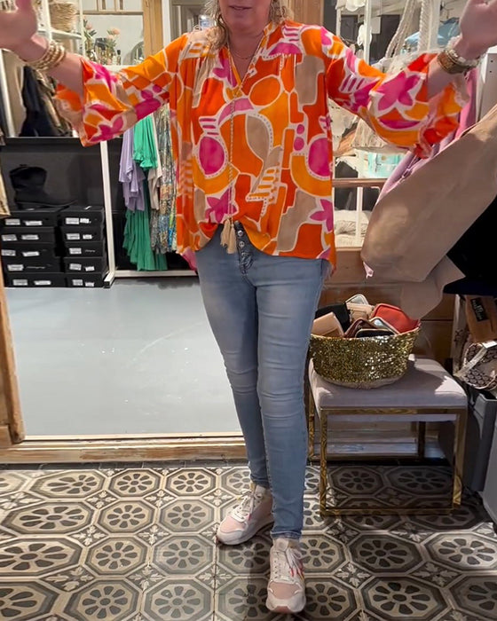 Blus med färgstarkt och långärmad design