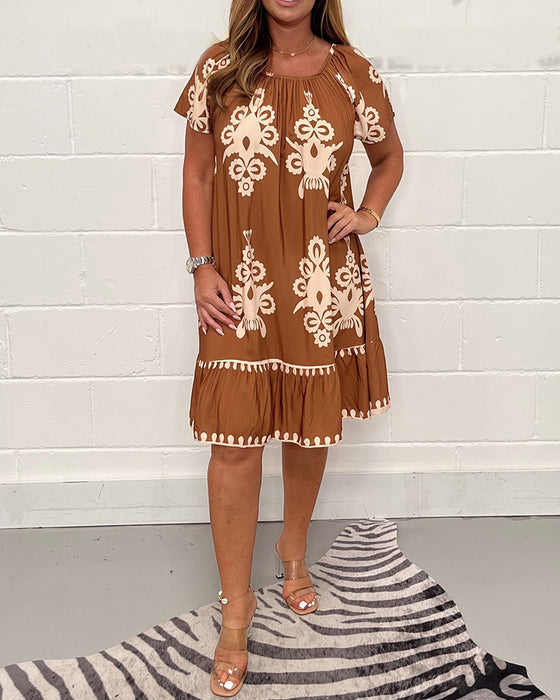 Tryckt klänning med rund hals