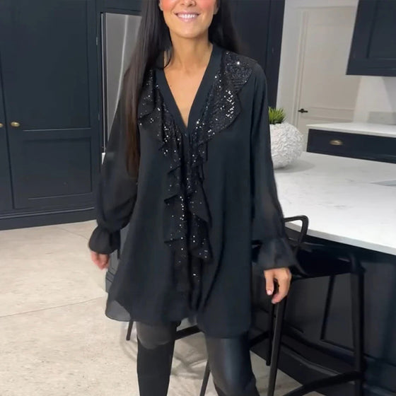 Blus med volanger och elegant stil