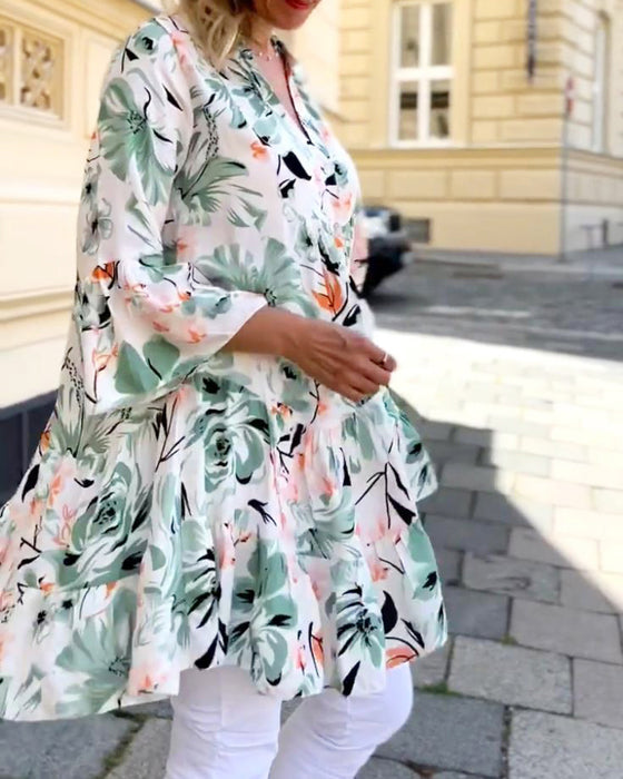 V-ringad blommig elegant blus